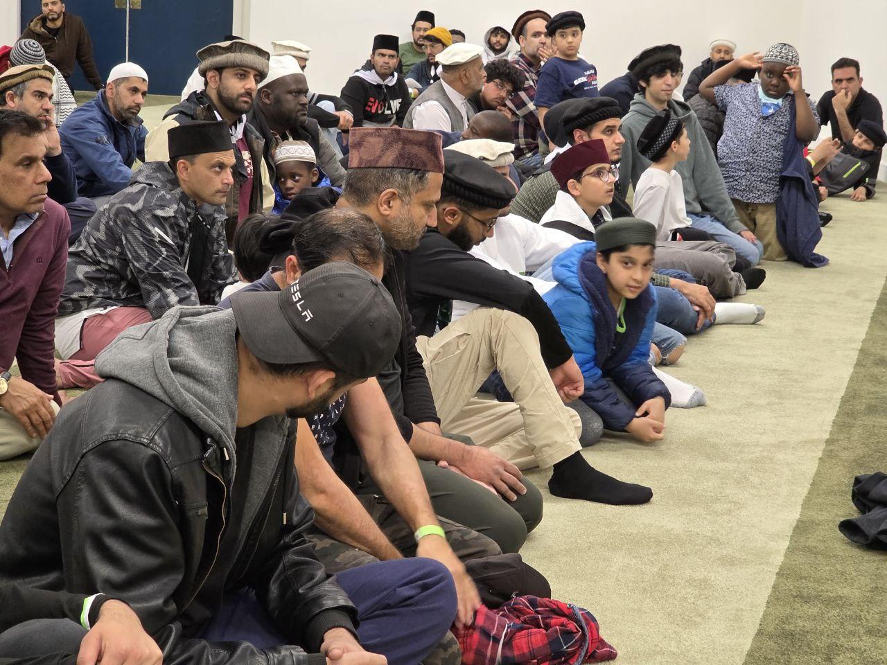Khuddam in conversation after congregational prayer