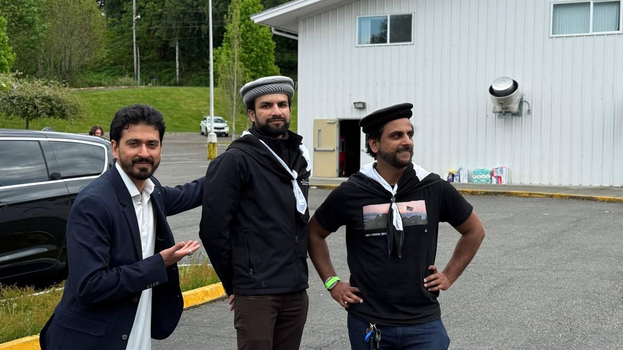 Khuddam sharing a moment between Ijtema sessions